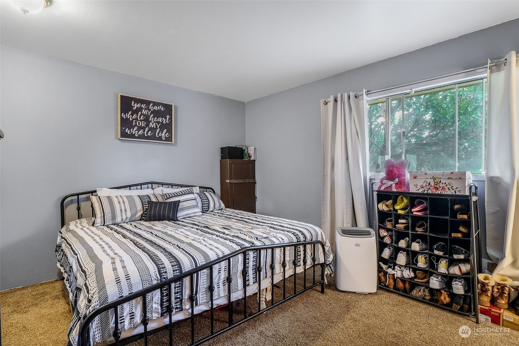 9012 B Bong Loop Moses Lake, WA 98837 - Photo 20 of 30 a bedroom with a bed a window and walk in closet