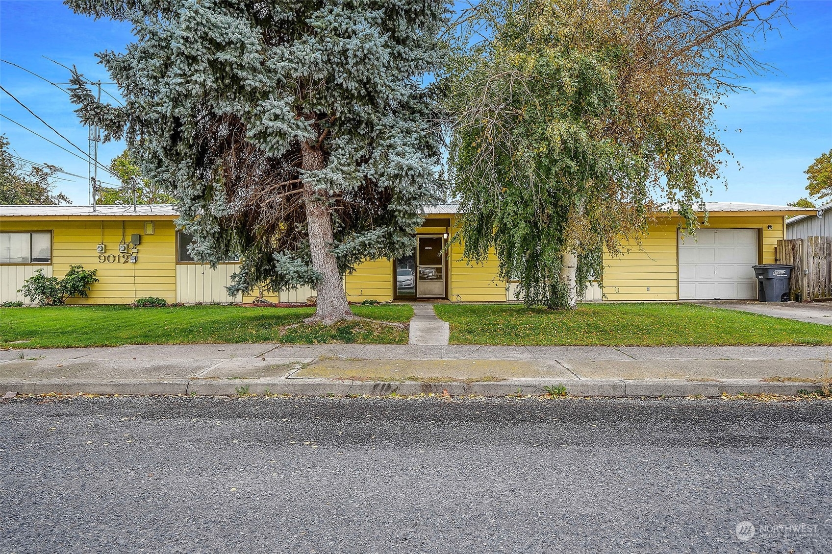 9012 B Bong Loop Moses Lake, WA 98837 - Photo 2 of 30 a building with trees in front of it