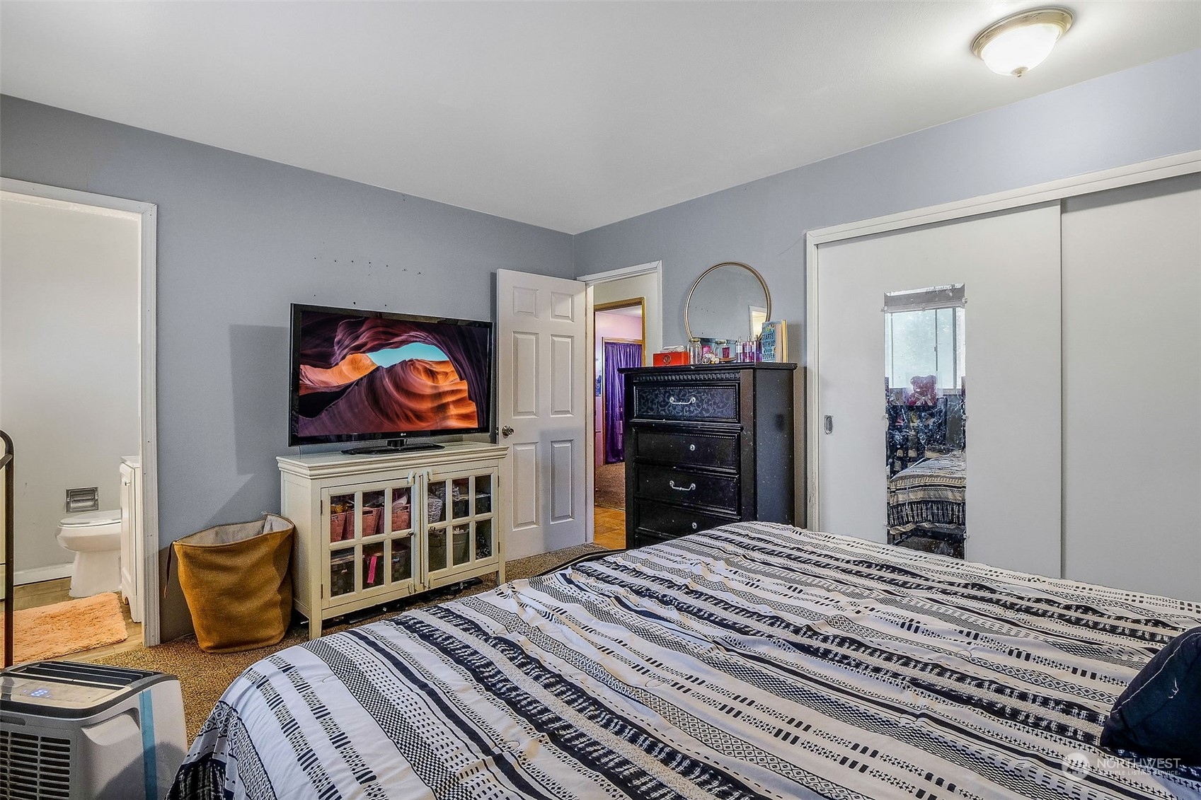9012 B Bong Loop Moses Lake, WA 98837 - Photo 21 of 30 a bedroom with furniture and a flat screen tv