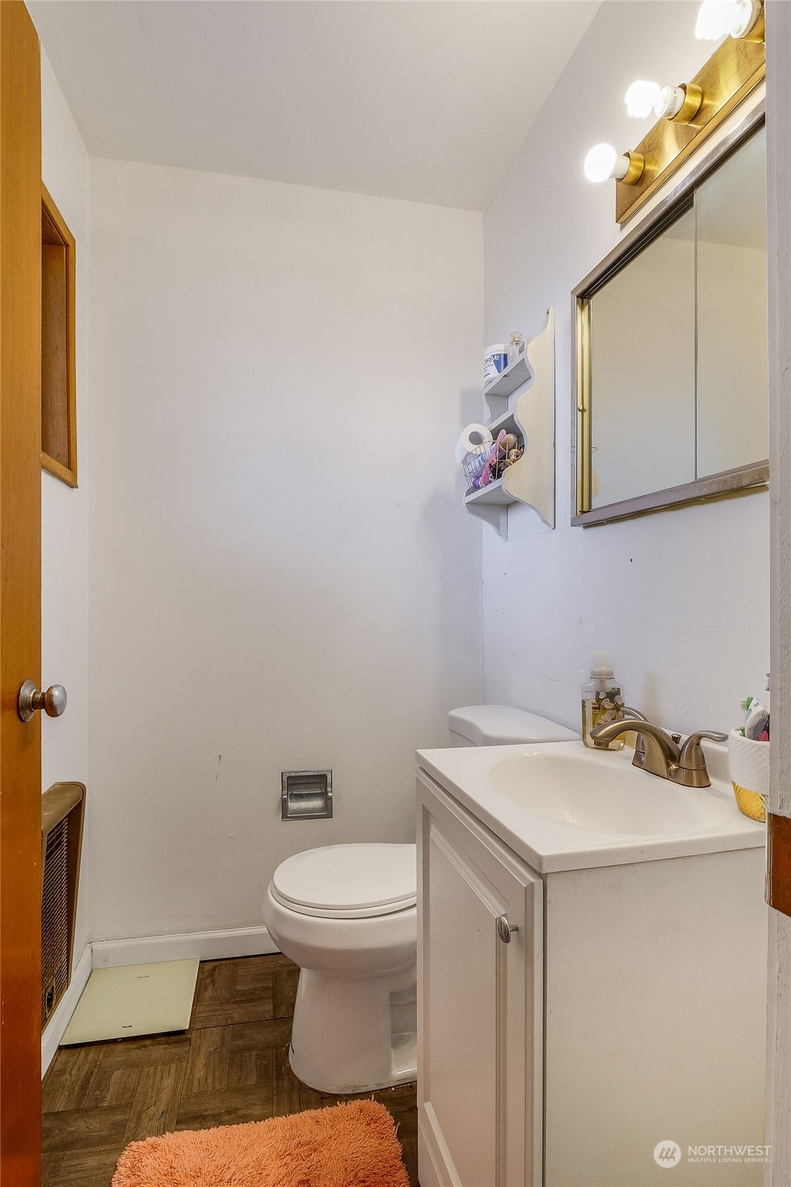 9012 B Bong Loop Moses Lake, WA 98837 - Photo 22 of 30 a bathroom with a sink a toilet and mirror