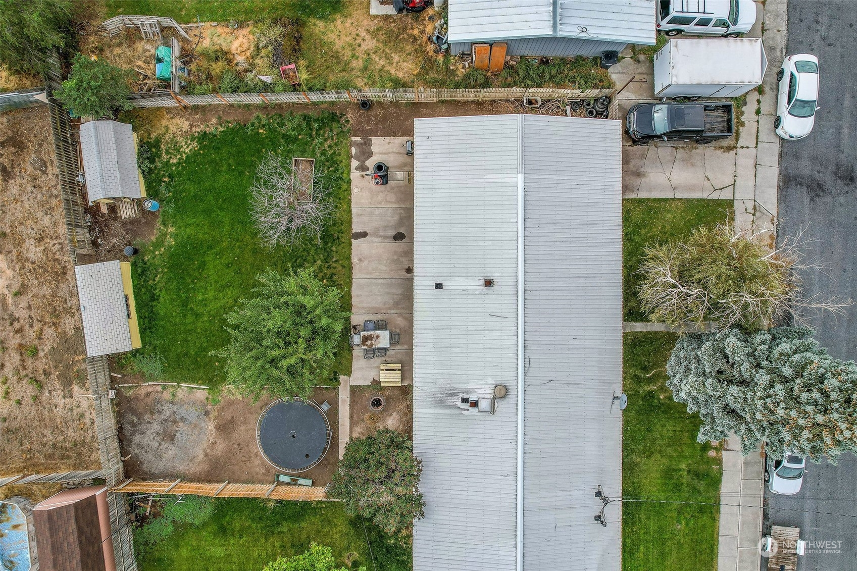 9012 B Bong Loop Moses Lake, WA 98837 - Photo 3 of 30 aerial view of a house with plants and large trees