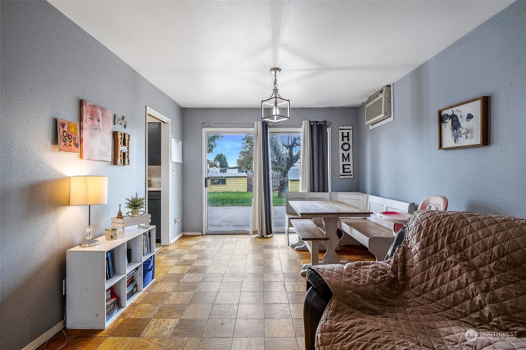 9012 B Bong Loop Moses Lake, WA 98837 - Photo 9 of 30 a bed room with a bed and a chandelier