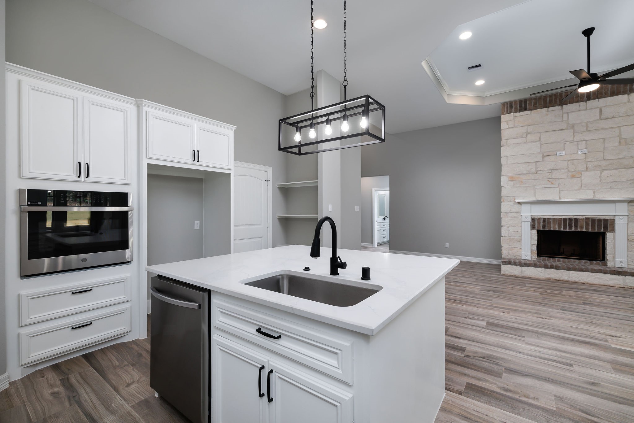 364 Dahlia Road Huntsville, TX 77320 - Photo 17 of 34 a kitchen with a sink stainless steel appliances and wooden floor