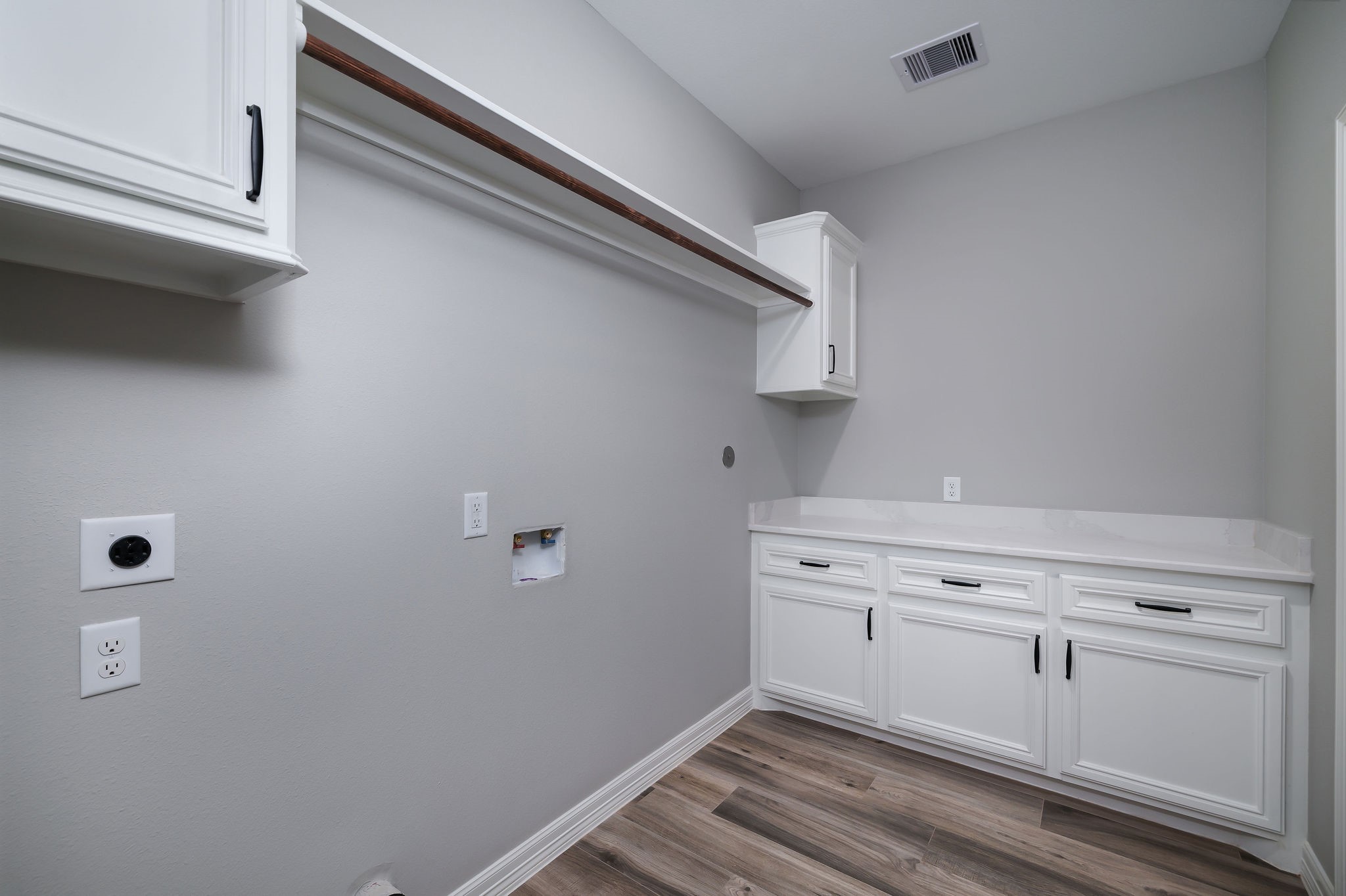 364 Dahlia Road Huntsville, TX 77320 - Photo 18 of 34 a view of a storage and utility room with cabinet