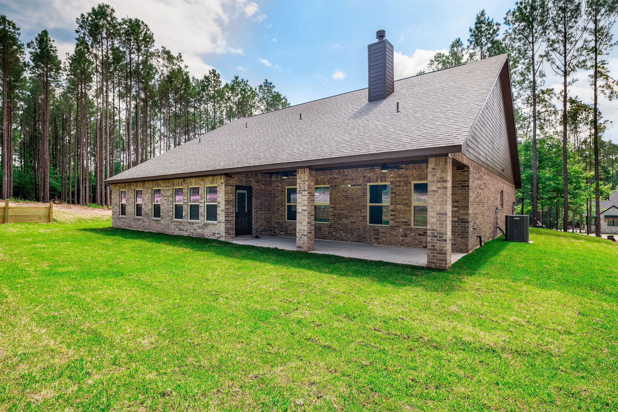 364 Dahlia Road Huntsville, TX 77320 - Photo 33 of 34 a view of a house with backyard and garden