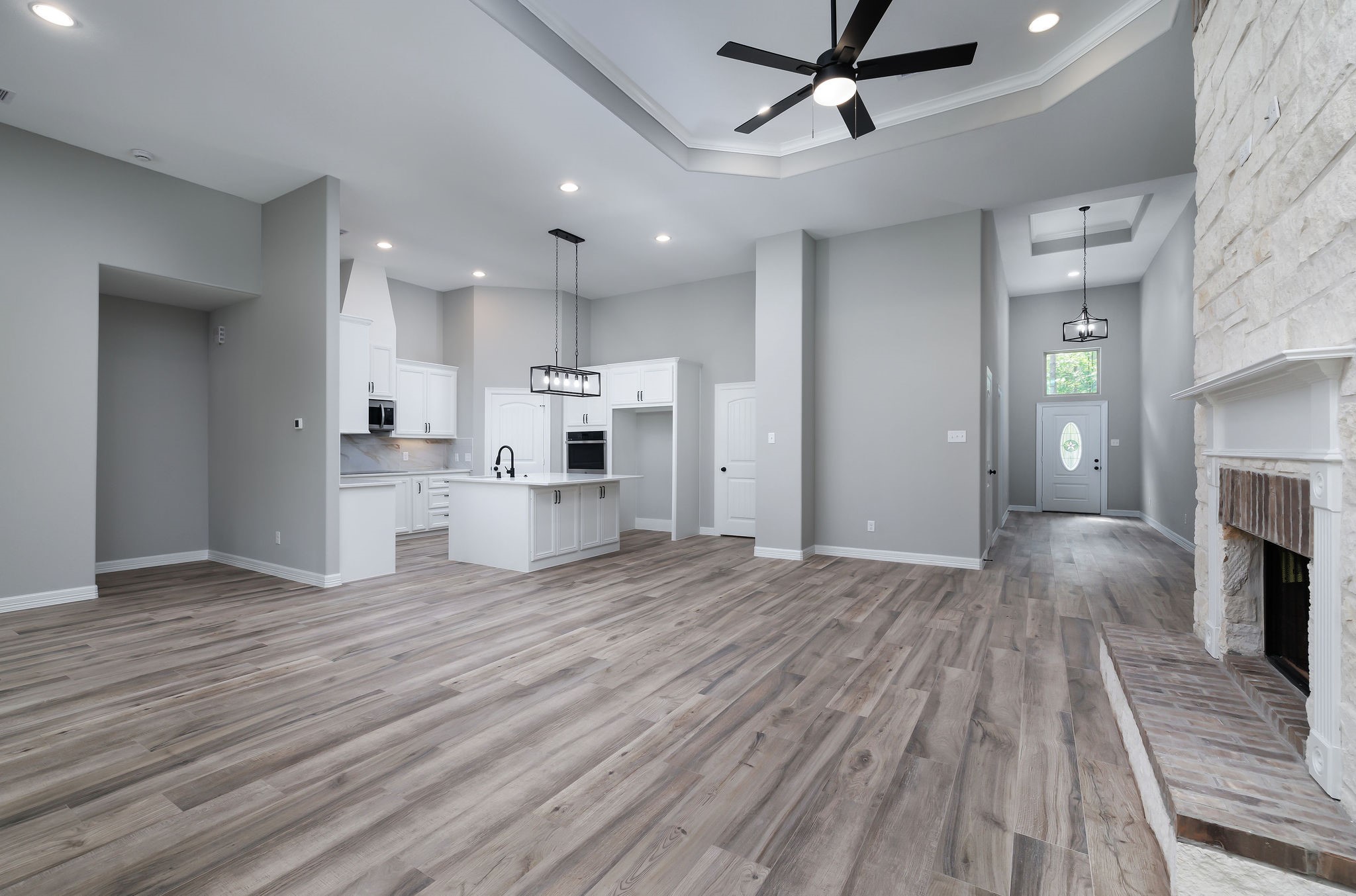 364 Dahlia Road Huntsville, TX 77320 - Photo 10 of 34 a view of a kitchen with a sink and dishwasher a refrigerator with wooden floor