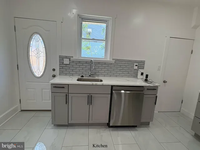 a bathroom with a sink vanity and a mirror