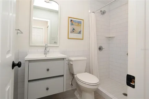 a view of a room with wooden floor and natural light
