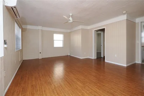 a bathroom with a sink a toilet a mirror and shower curtain