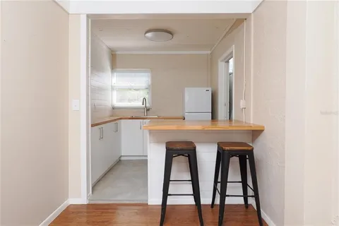 a swimming pool with outdoor seating and yard