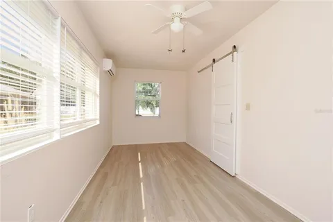 a view of a house with backyard and porch