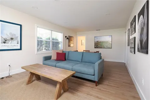 a dining room with a wooden table and chairs