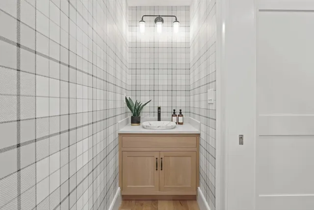 a bathroom with a sink a vanity and a mirror