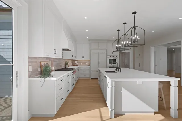 a large kitchen with sink and cabinets