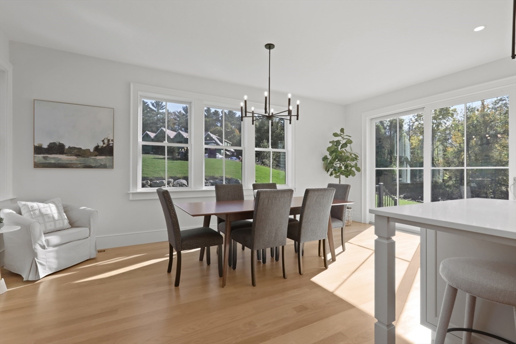56 Sunset Rock Road Andover, MA 01810 - Photo 14 of 42 a view of a dining room with furniture window and outside view