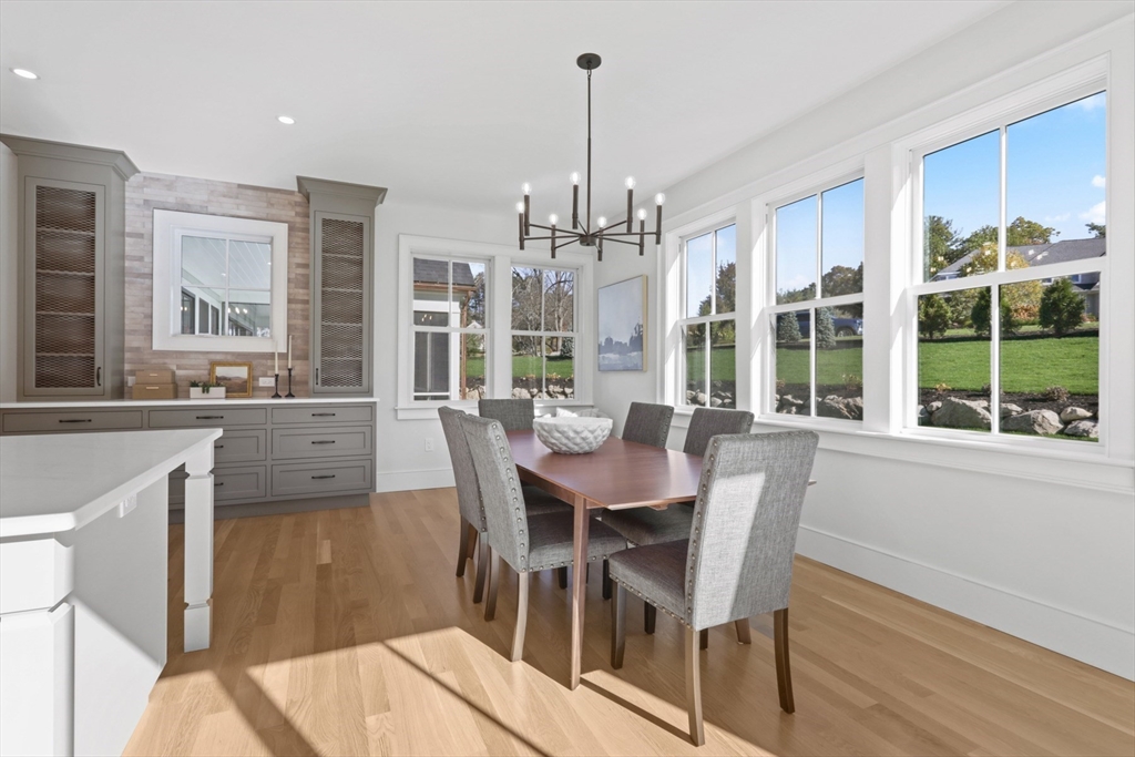 56 Sunset Rock Road Andover, MA 01810 - Photo 15 of 42 a view of a dining room with furniture window and outside view