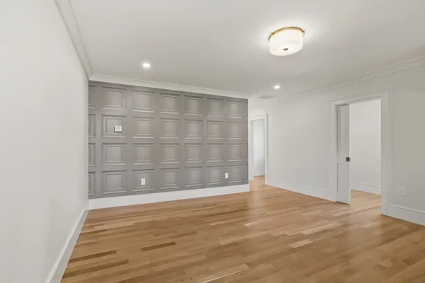 a view of wooden floor with white walls