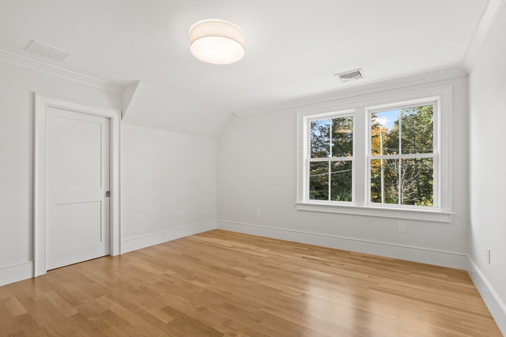 56 Sunset Rock Road Andover, MA 01810 - Photo 27 of 42 a view of an empty room with a window