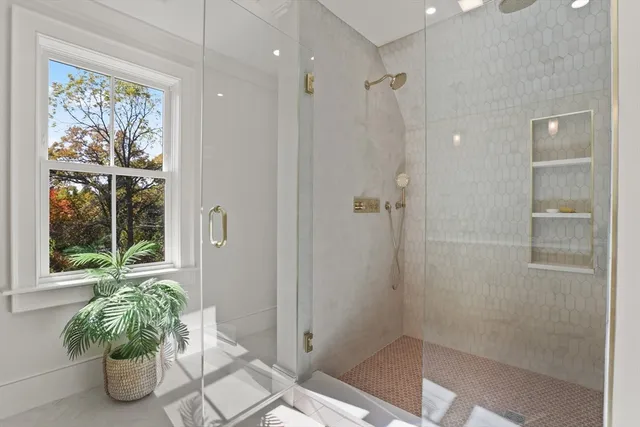 a spacious bathroom with a granite countertop sink and a mirror