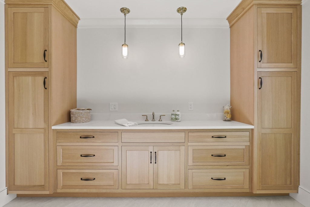 56 Sunset Rock Road Andover, MA 01810 - Photo 35 of 42 a spacious bathroom with a granite countertop sink and a mirror