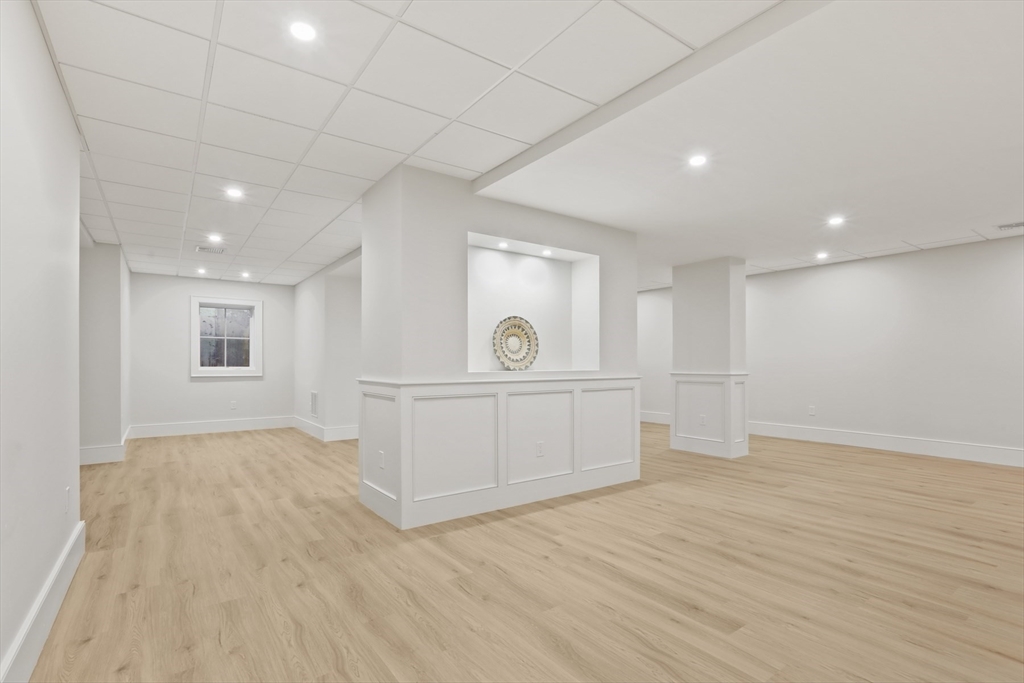 56 Sunset Rock Road Andover, MA 01810 - Photo 38 of 42 a view of a hallway with wooden floor