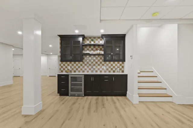 a view of a livingroom with wooden floor and white walls