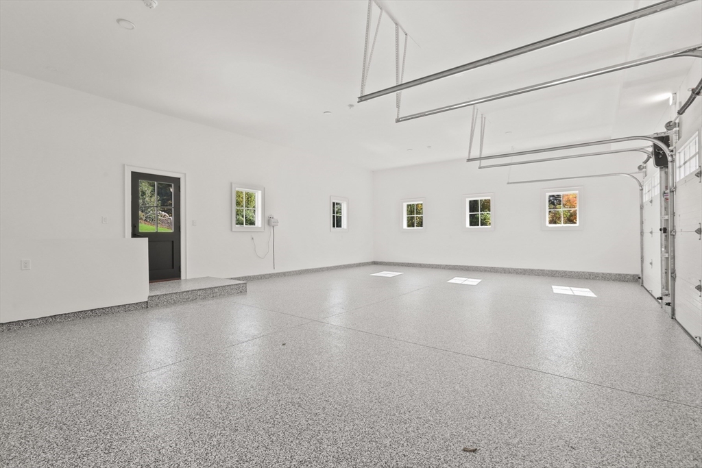 56 Sunset Rock Road Andover, MA 01810 - Photo 41 of 42 a view of a livingroom with wooden floor and white walls