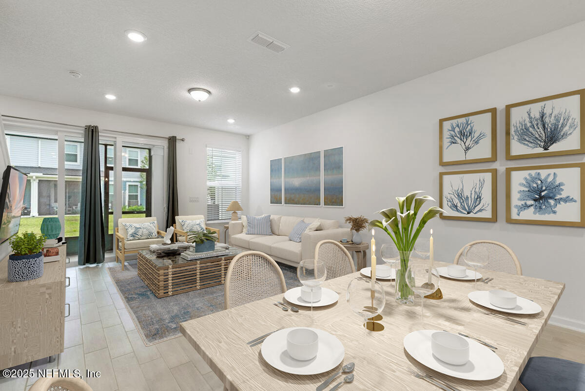 39 Thurnham Lane St. Augustine, FL 32092 - Photo 1 of 52 a dining room with furniture a large window and wooden floor