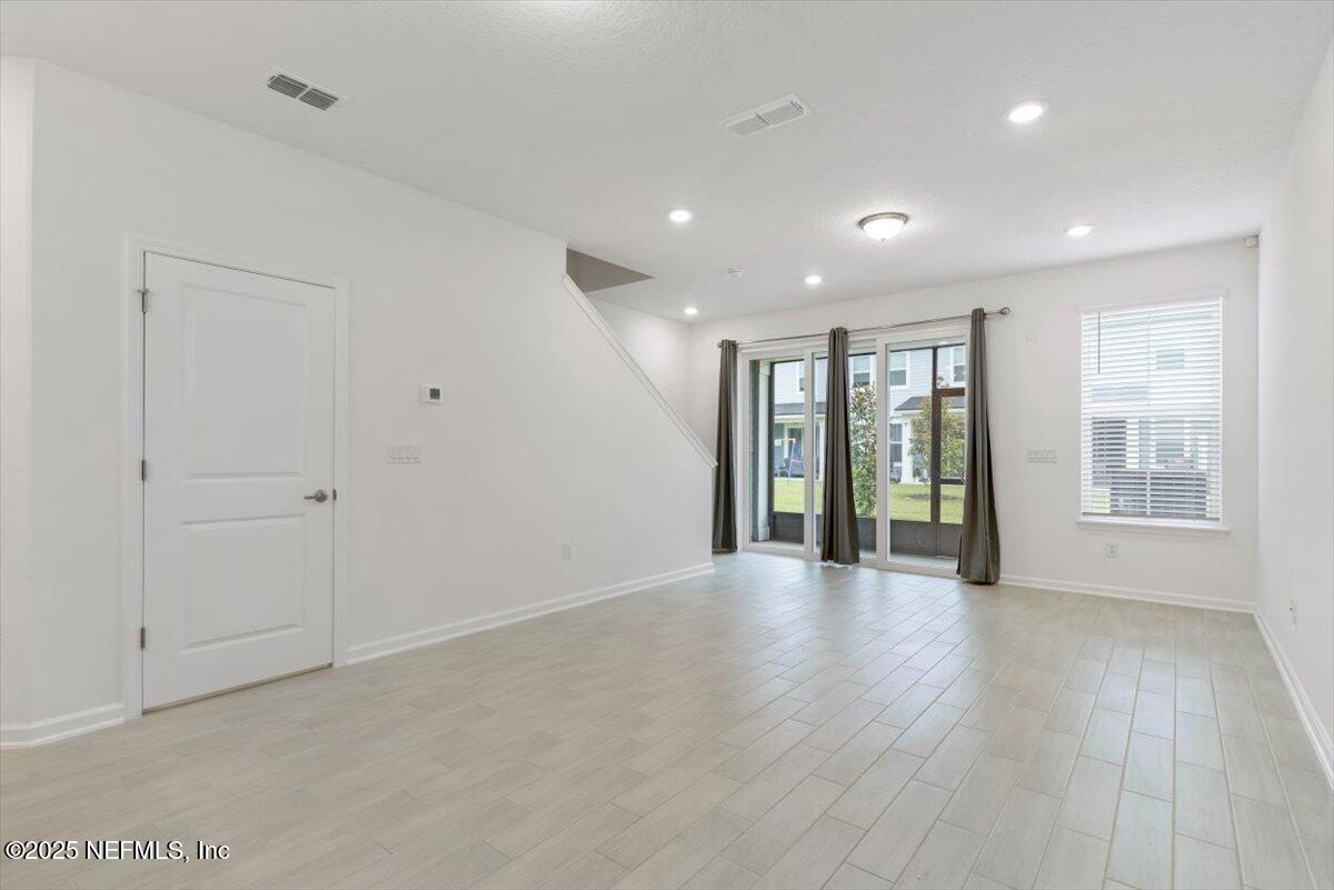 39 Thurnham Lane St. Augustine, FL 32092 - Photo 11 of 52 a view of an empty room with glass door and balcony