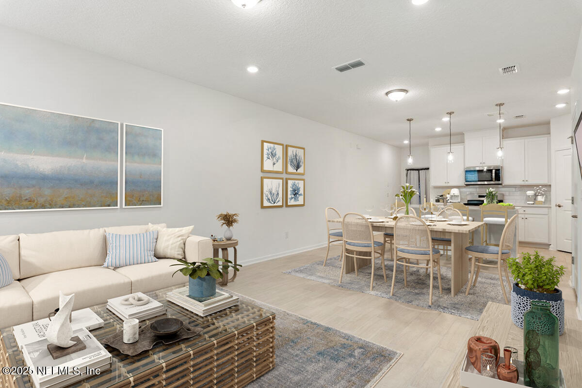 39 Thurnham Lane St. Augustine, FL 32092 - Photo 12 of 52 a living room with furniture kitchen and a table