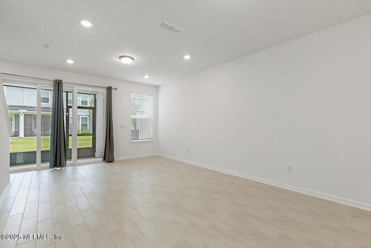 39 Thurnham Lane St. Augustine, FL 32092 - Photo 13 of 52 a view of an empty room with glass door