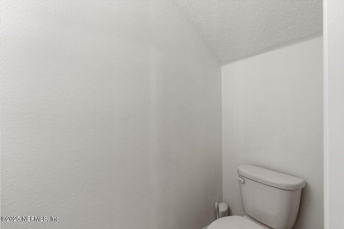 39 Thurnham Lane St. Augustine, FL 32092 - Photo 14 of 52 a white toilet sitting next to a white wall