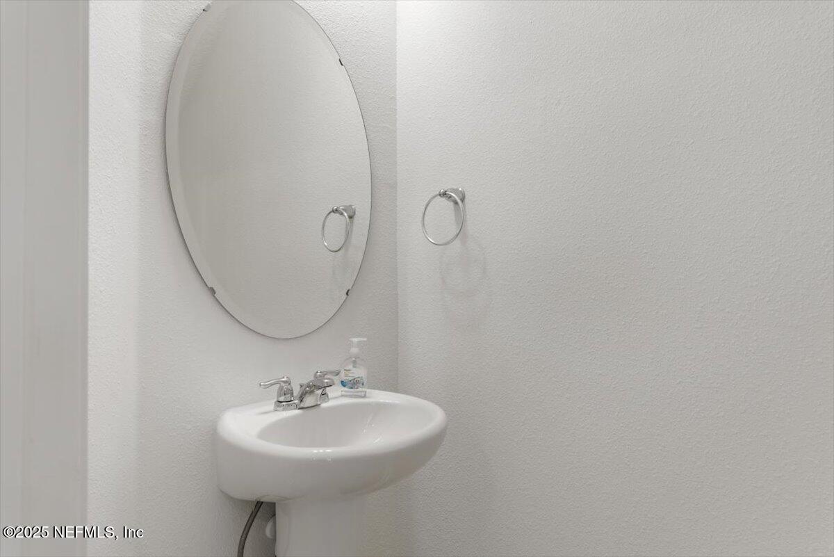 39 Thurnham Lane St. Augustine, FL 32092 - Photo 15 of 52 a bathroom with a sink and a mirror