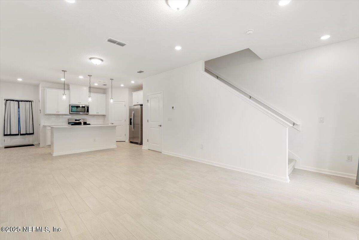 39 Thurnham Lane St. Augustine, FL 32092 - Photo 18 of 52 a view of a kitchen with refrigerator and a sink