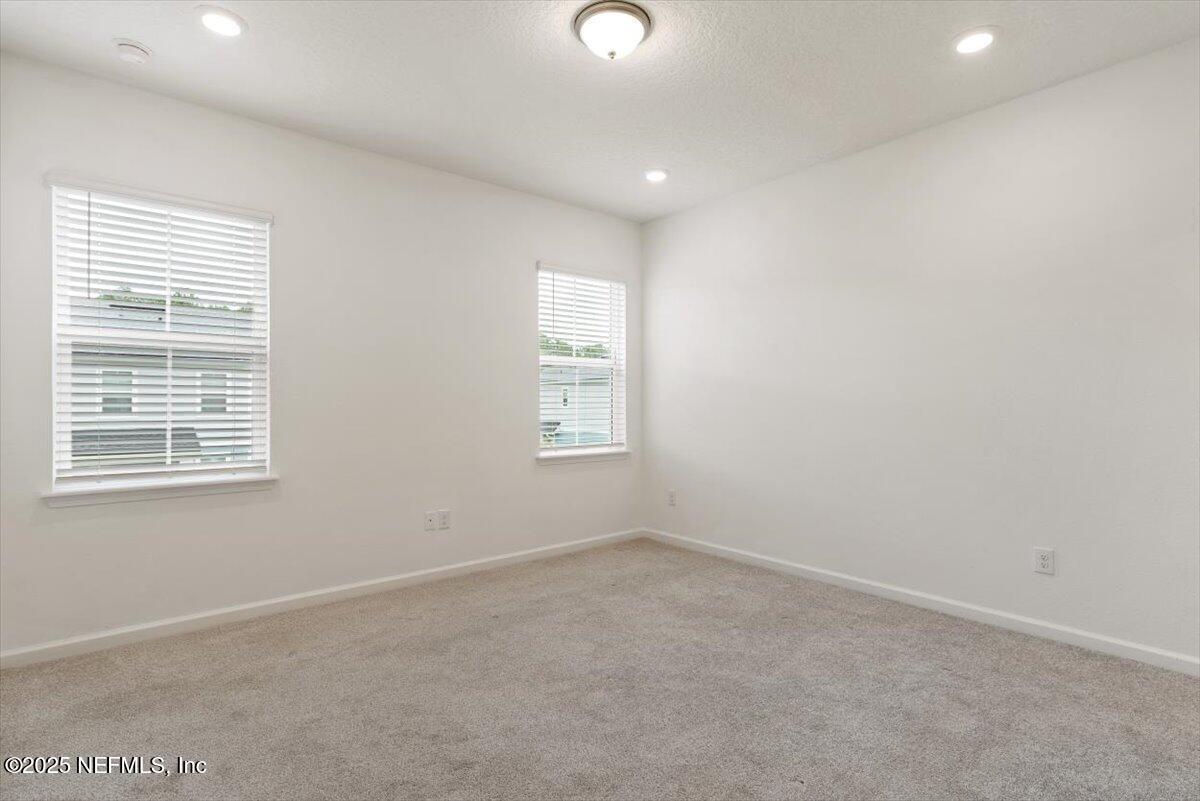 39 Thurnham Lane St. Augustine, FL 32092 - Photo 22 of 52 an empty room with windows