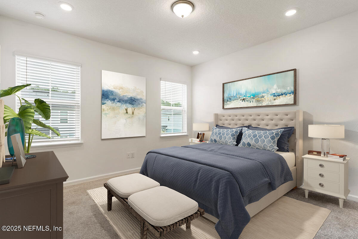 39 Thurnham Lane St. Augustine, FL 32092 - Photo 23 of 52 a bedroom with a bed and a couch