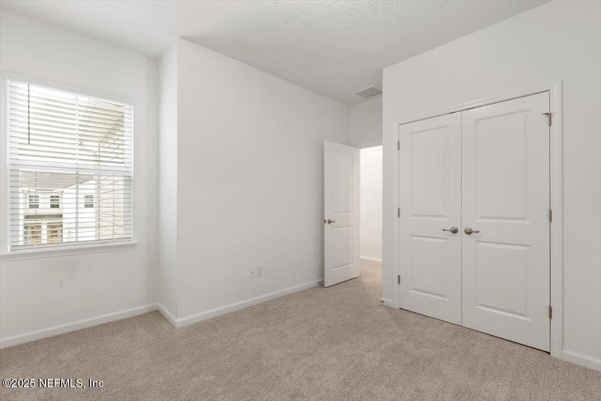 39 Thurnham Lane St. Augustine, FL 32092 - Photo 30 of 52 a view of an empty room with a window