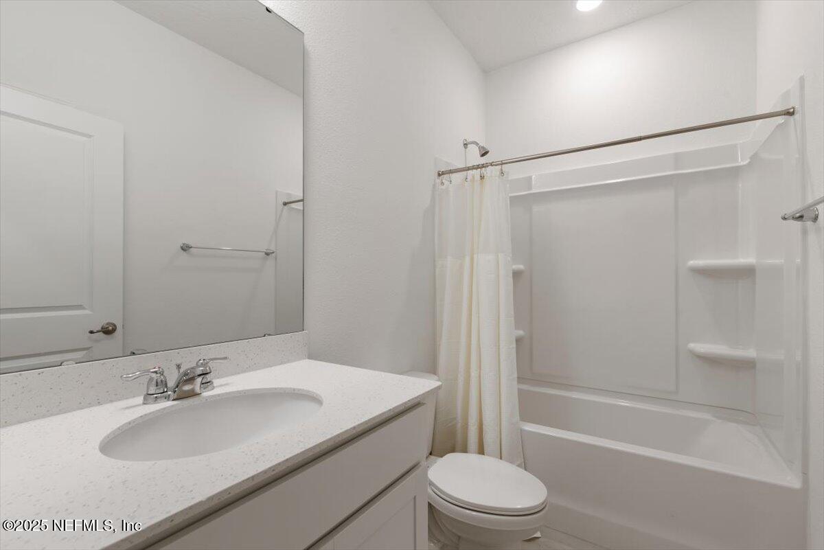 39 Thurnham Lane St. Augustine, FL 32092 - Photo 31 of 52 a bathroom with a granite countertop sink toilet and shower