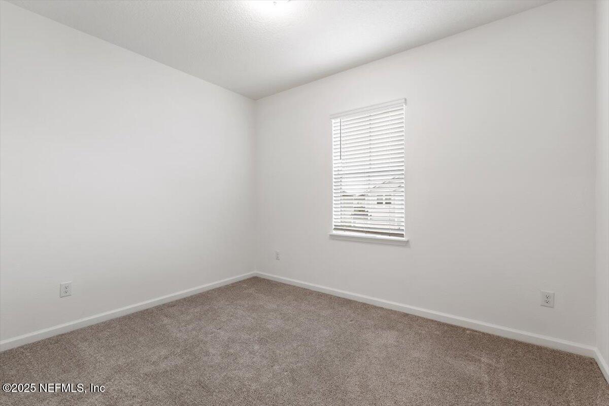 39 Thurnham Lane St. Augustine, FL 32092 - Photo 33 of 52 an empty room with a window