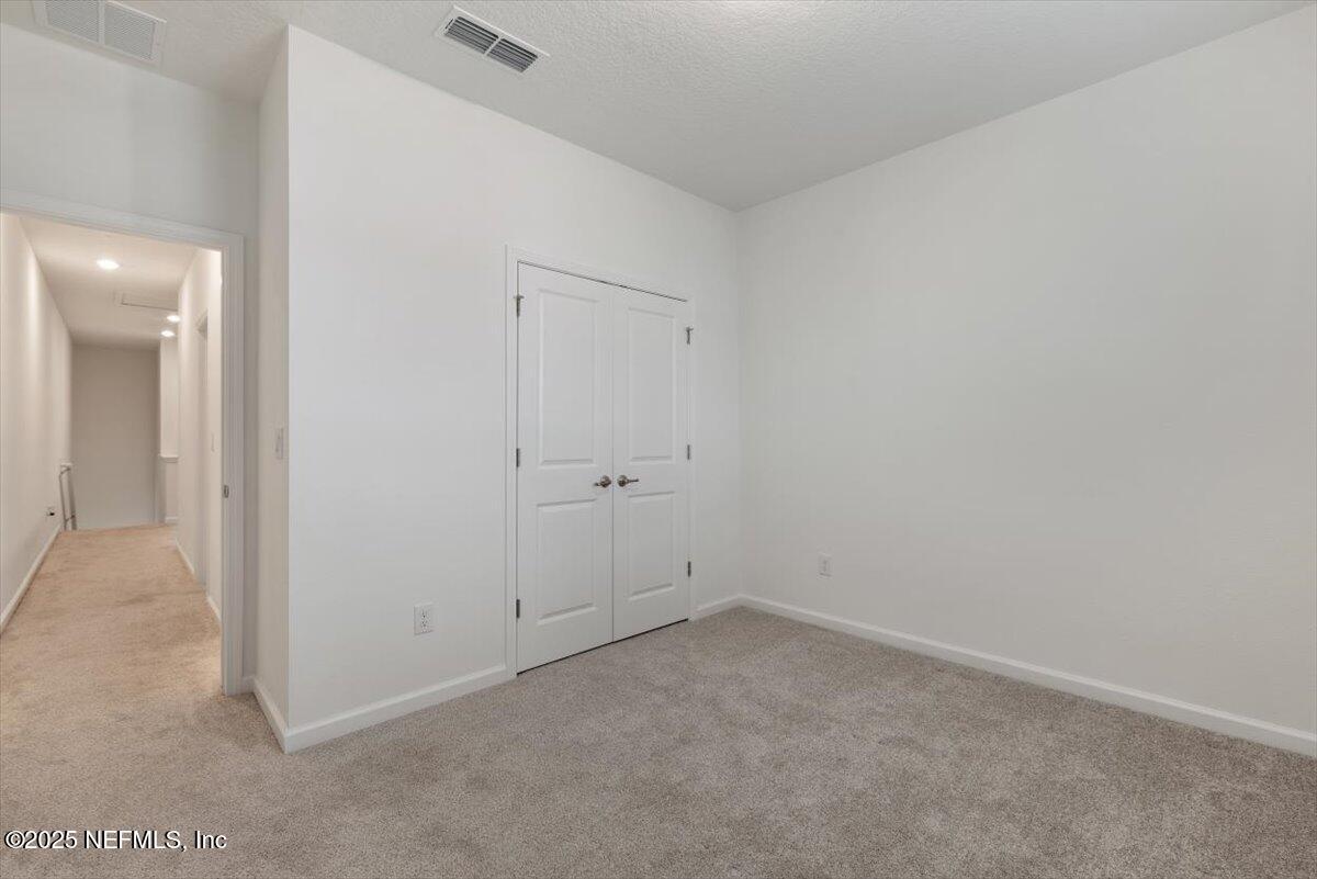 39 Thurnham Lane St. Augustine, FL 32092 - Photo 34 of 52 an empty room with a hallway