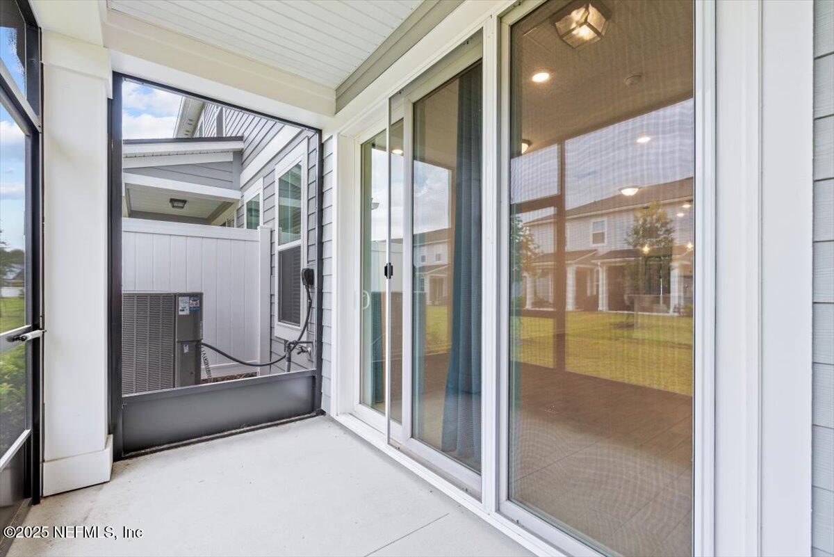 39 Thurnham Lane St. Augustine, FL 32092 - Photo 36 of 52 a view of a glass door of the house