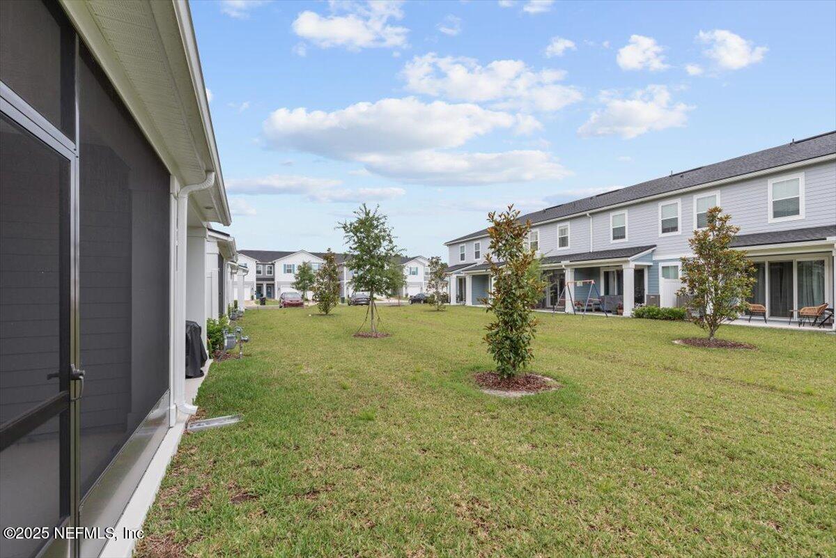 39 Thurnham Lane St. Augustine, FL 32092 - Photo 37 of 52 a front view of a house with a yard