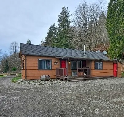 a front view of a house with yard