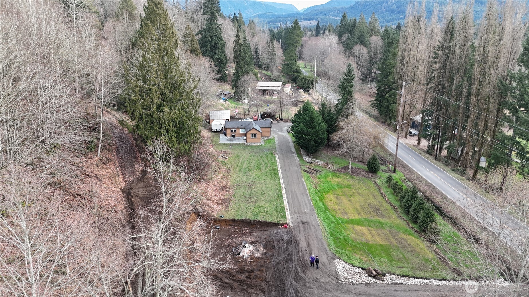 15421 Jim Creek Road Arlington, WA 98223 - Photo 20 of 27 a view of a yard with plants and large trees
