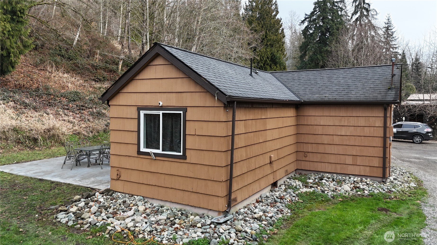 15421 Jim Creek Road Arlington, WA 98223 - Photo 24 of 27 a view of a small house with a yard
