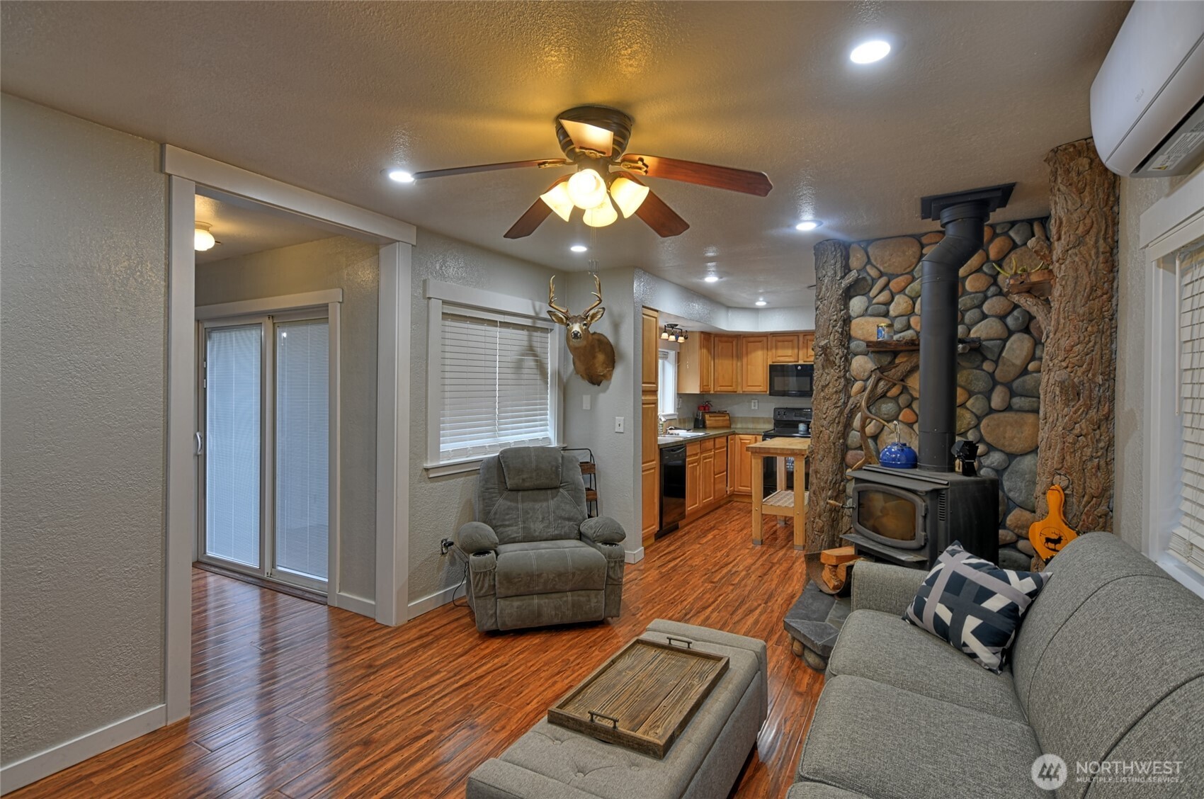 15421 Jim Creek Road Arlington, WA 98223 - Photo 3 of 27 a living room with furniture and a chandelier