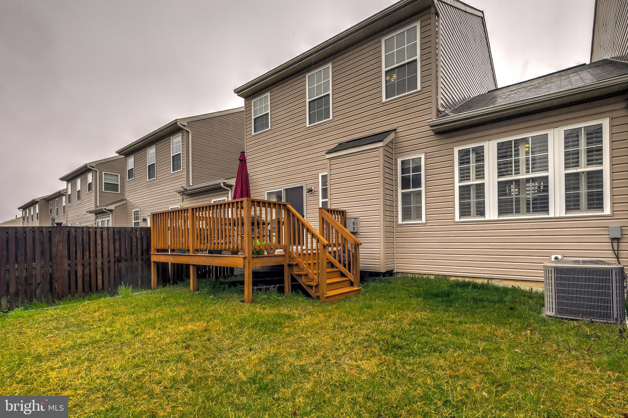 9727 Biggs Road Baltimore, MD 21220 - Photo 34 of 35 a view of a house with a yard and sitting area