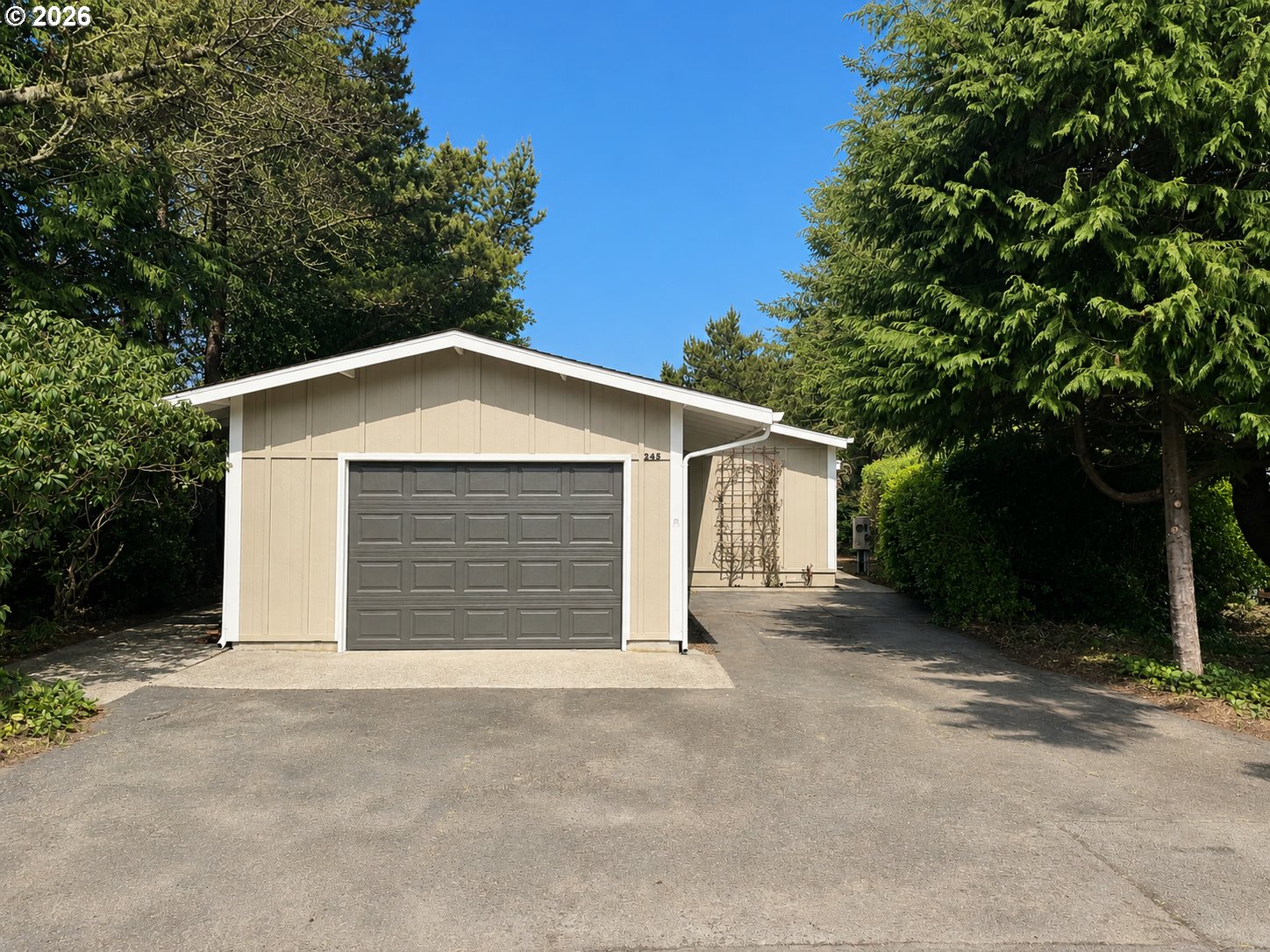 1600 Rhododendron Drive, Unit 245 Florence, OR 97439 - Photo 1 of 47 front view of a house with a yard