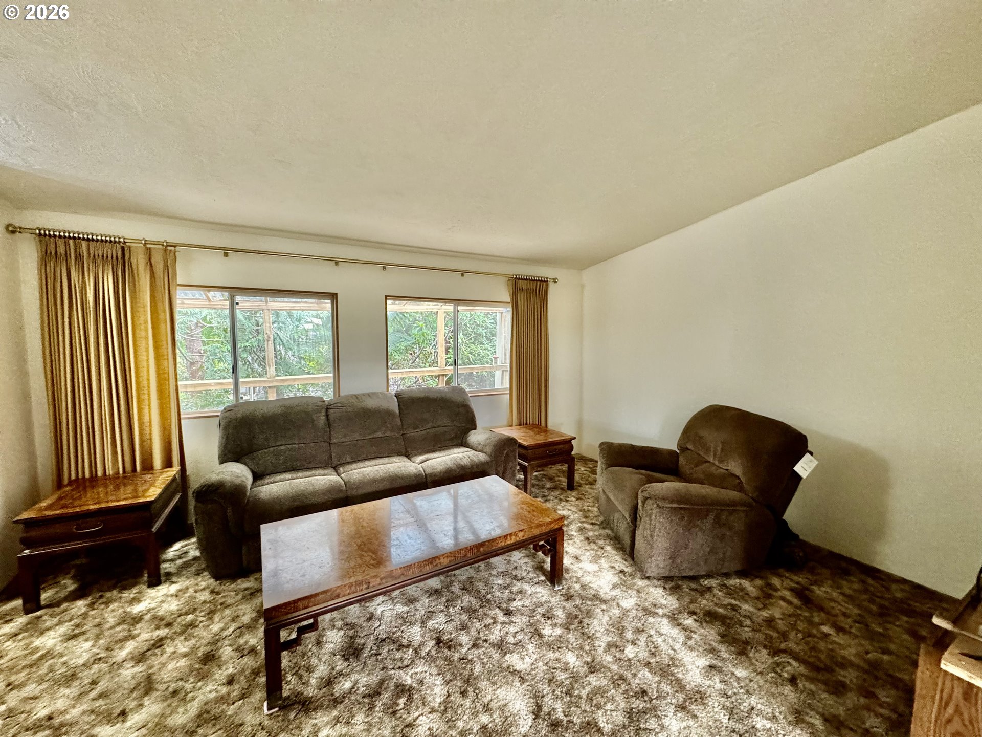1600 Rhododendron Drive, Unit 245 Florence, OR 97439 - Photo 11 of 47 a living room with furniture and a window