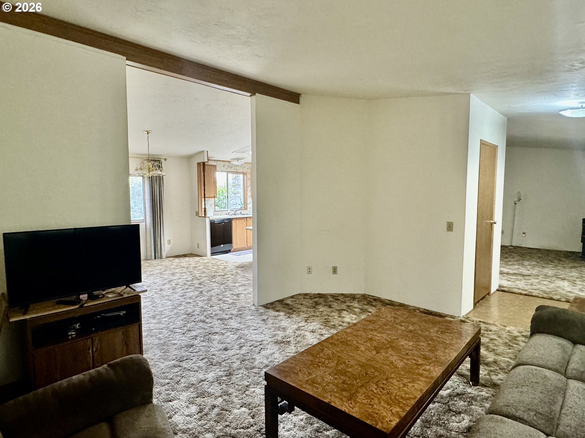 1600 Rhododendron Drive, Unit 245 Florence, OR 97439 - Photo 13 of 47 a living room with furniture rug and flat screen tv